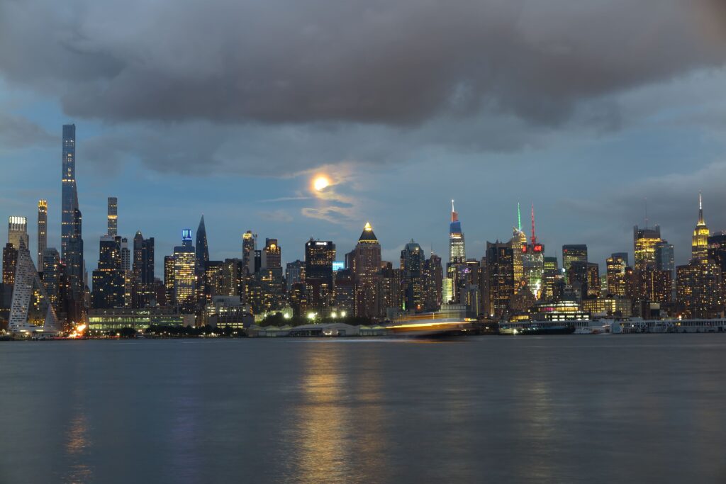 beautiful-Manhattan-night-view-and-moon-seen-from-new-jersey Credits: vecteezy