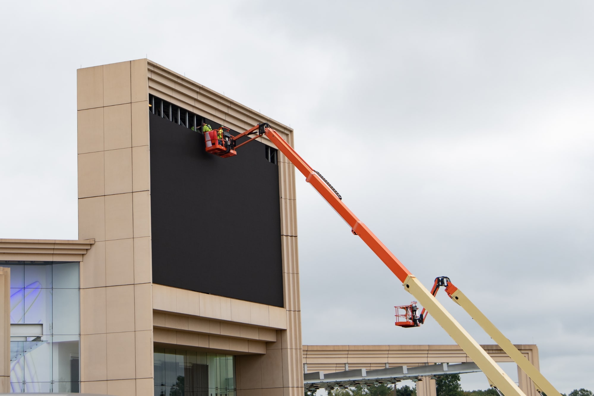 A man on crane fixing signage by BlinkSigns