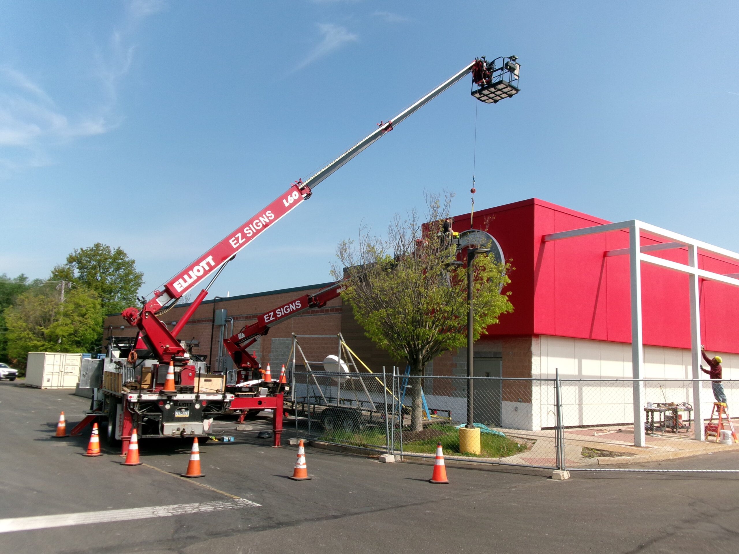 a crane maintaining signage of target store through BlinkSigns