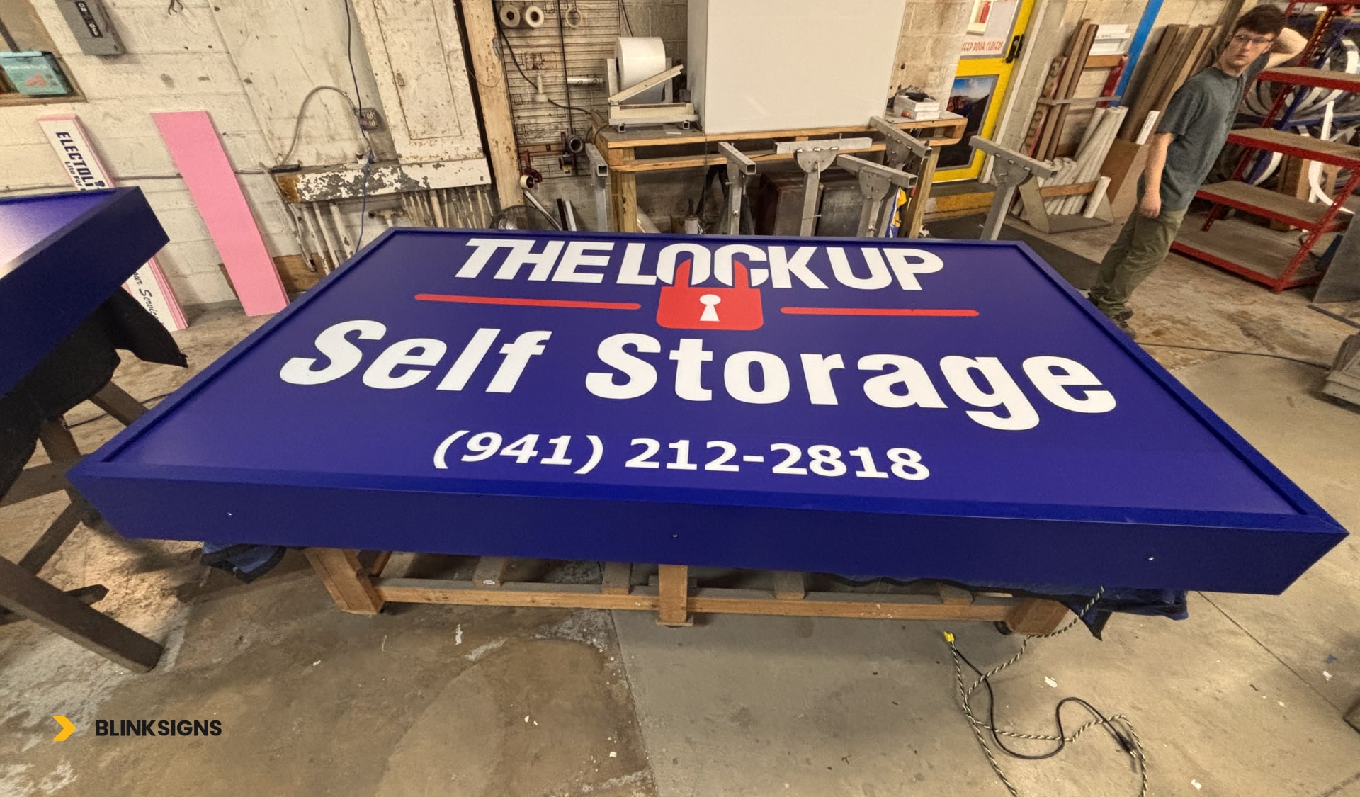 The LockUp Self Storage signage in a production warehouse