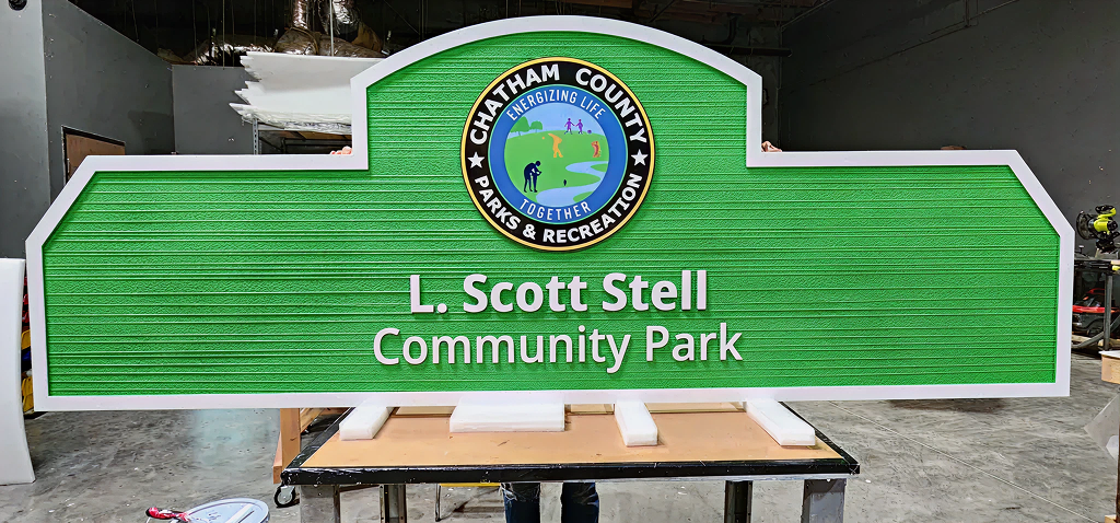 Wayfinding green Signage of L. Scott Stell Community Park in a warehouse
