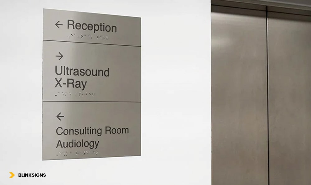 Wayfinding Accessibility: Designing Inclusive Navigation Systems for All Users 6 Accessible wayfinding signage on metal plate