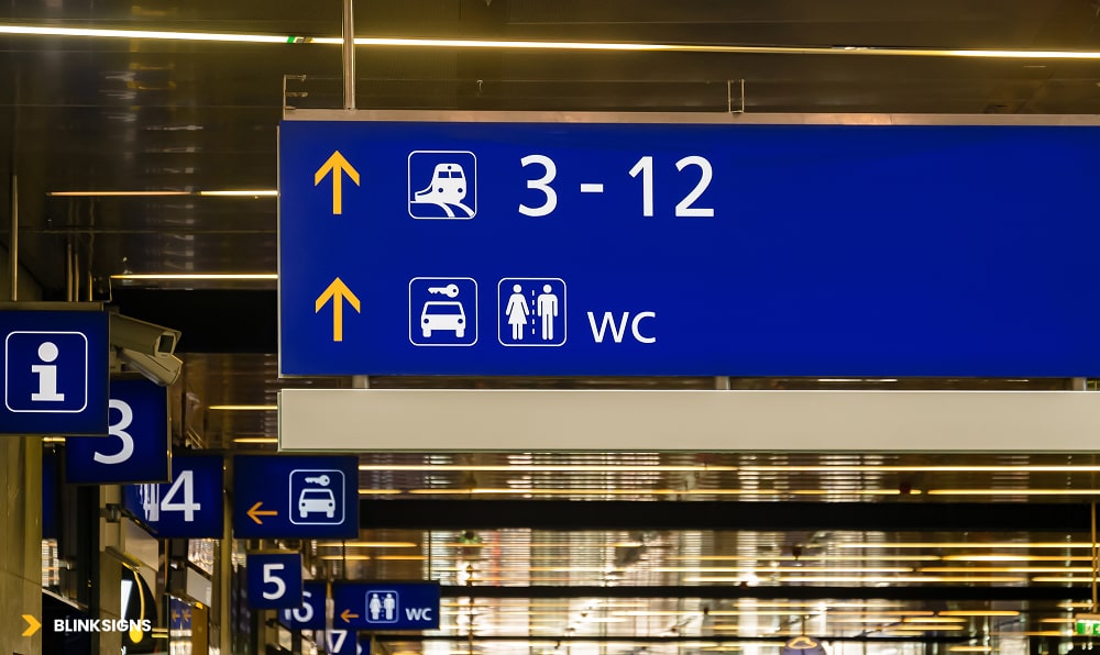 Wayfinding Color Psychology: How Design Choices Influence Navigation 3 tram no signs in blue color and white text on it at a station