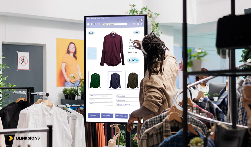 Predictive AI for Digital Signage: How Autonomous Content Engines Will Reshape 2026 3 A woman looks at a large screen featuring clothing items in a retail environment.