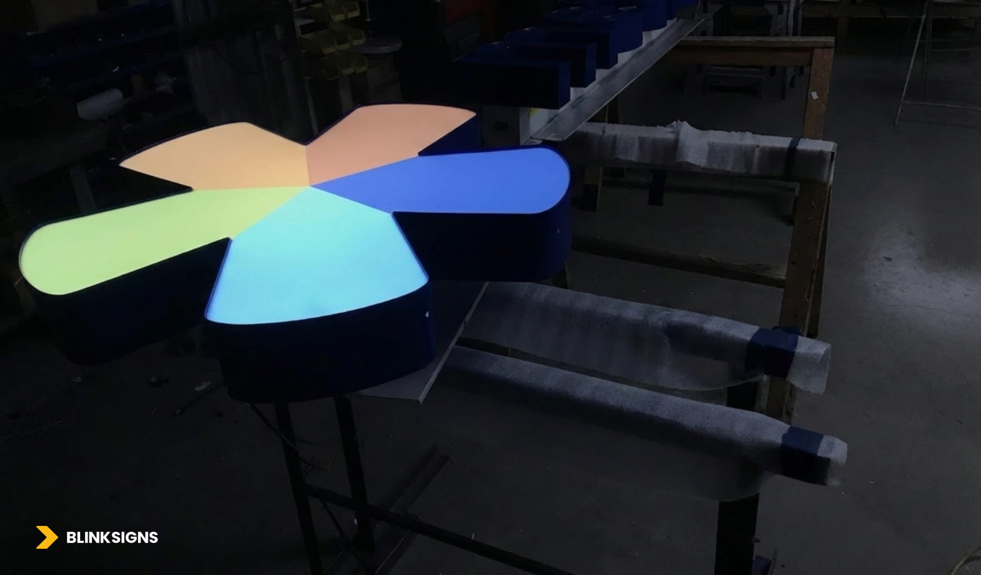 Metro logo icon front-lit signage in a factory