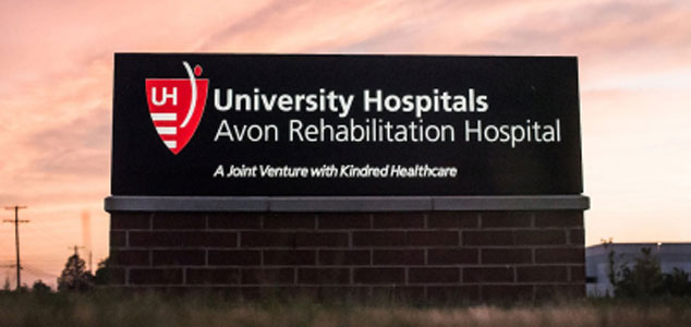 University Hospital monument Sign under open sky