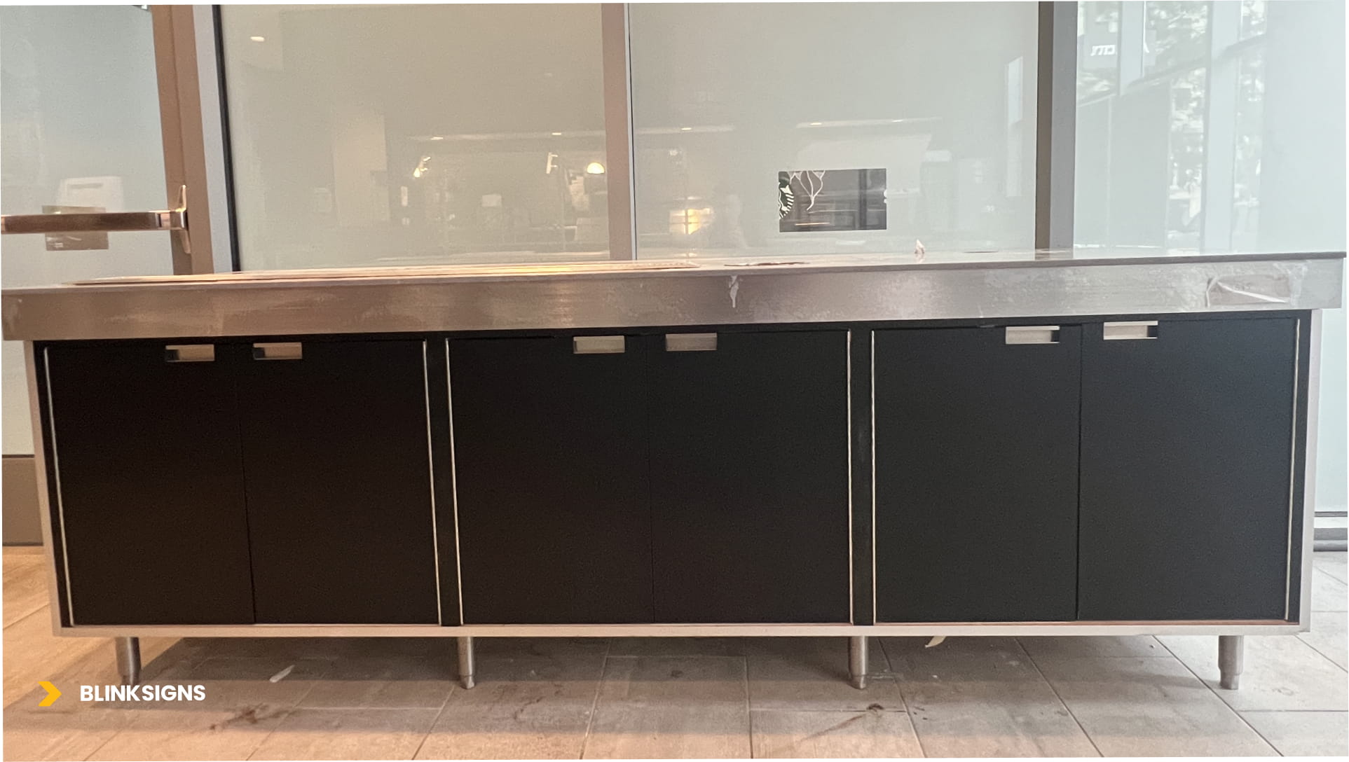 Commercial cabinetry refinished with sleek 3M Di-Noc ME-1685 metallic film and stainless steel hardware for a modern look.